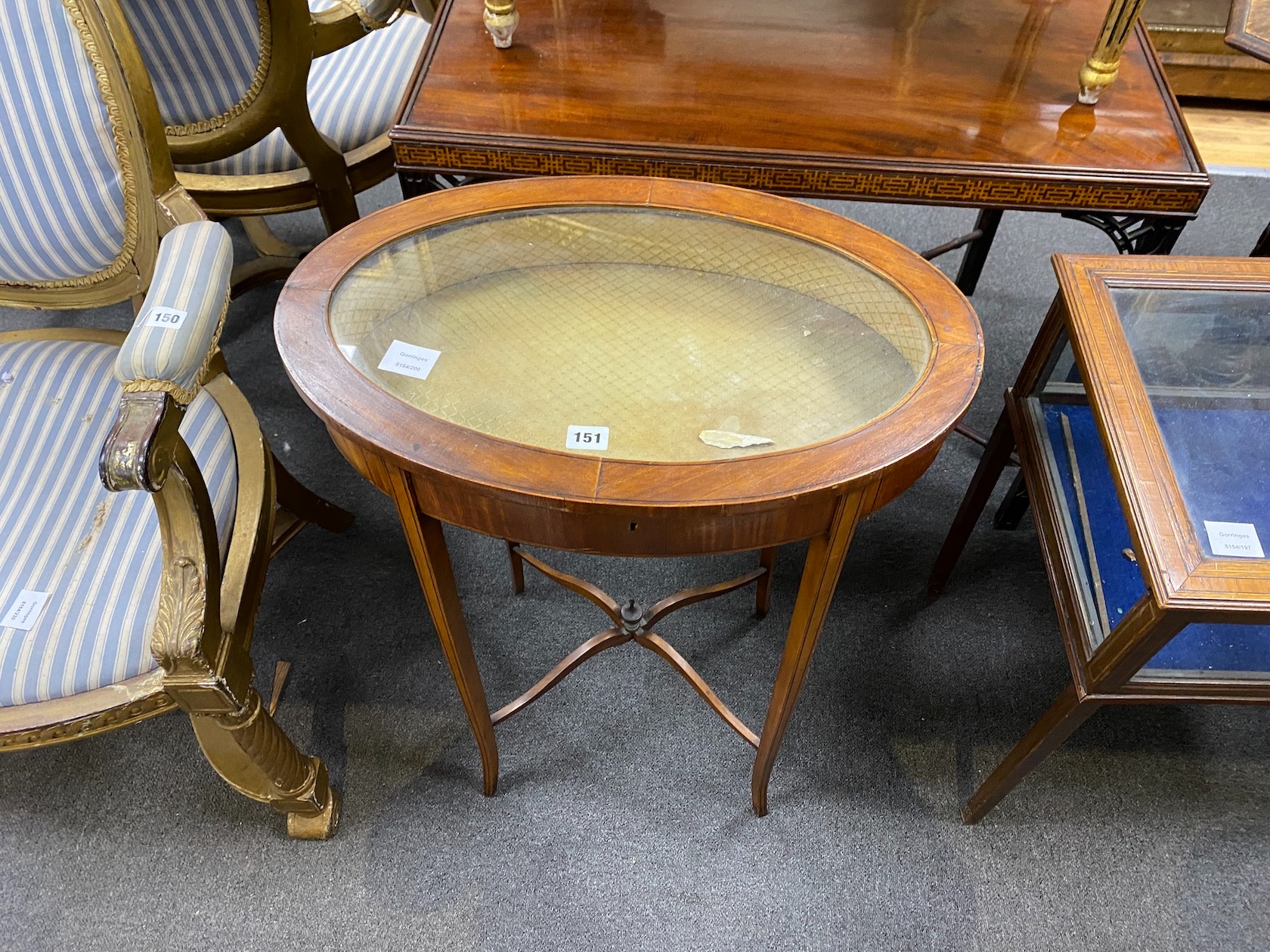 An Edwardian inlaid satinwood oval bijouterie table, width 58cm, depth 38cm, height 76cm